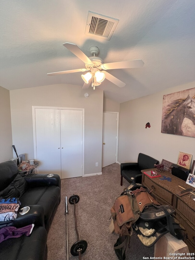 carpeted office space with lofted ceiling and ceiling fan