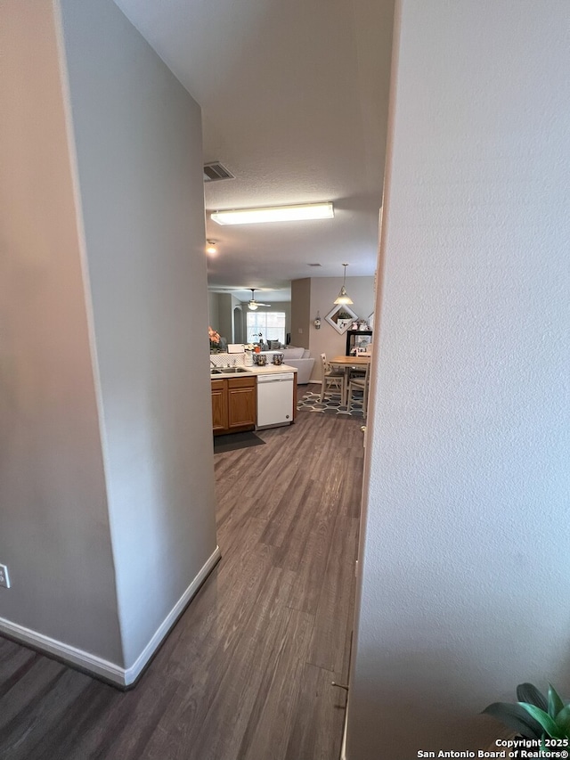 hall with sink and dark hardwood / wood-style flooring