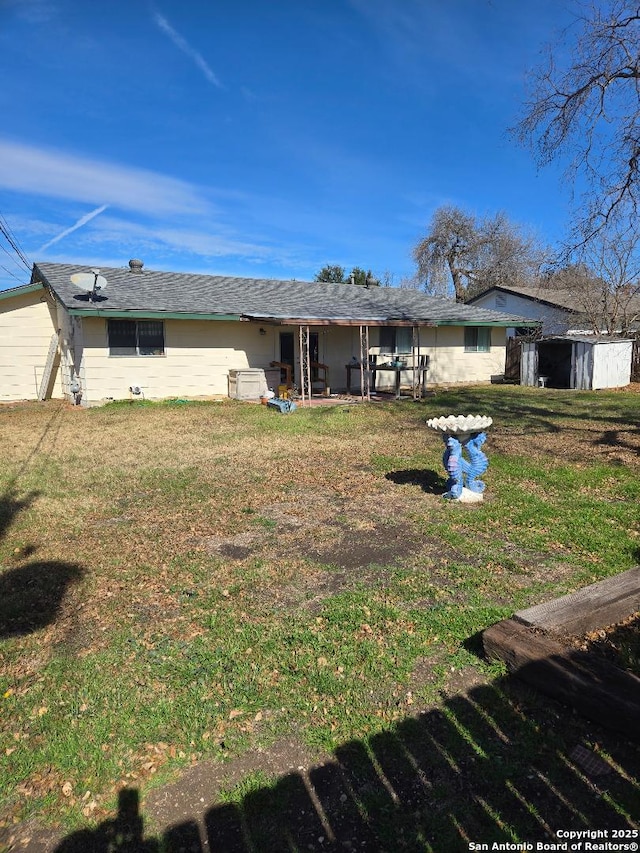 5550 Aspen Vly, San Antonio, TX 78242 - rear view of house with a yard