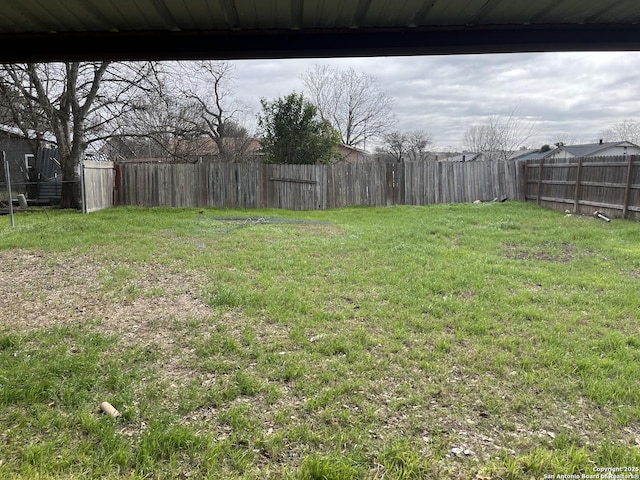 view of yard with a fenced backyard