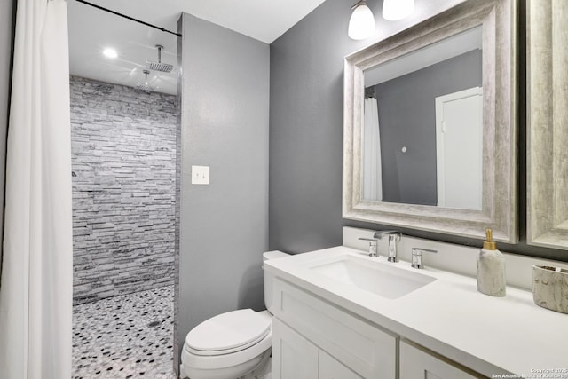 8907 Athens, San Antonio, TX 78251 - bathroom featuring toilet, vanity, and a shower with curtain