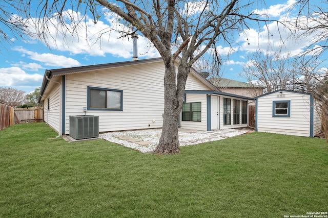 8907 Athens, San Antonio, TX 78251 - back of house featuring central air condition unit, a storage shed, and a lawn