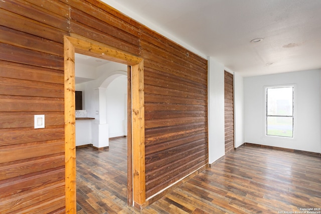 hallway featuring dark hardwood / wood-style flooring