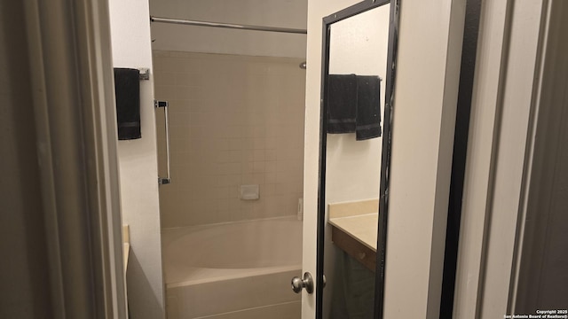 bathroom featuring shower / tub combination and vanity