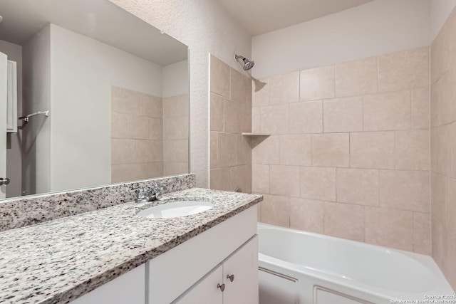 bathroom featuring shower / bath combination and vanity