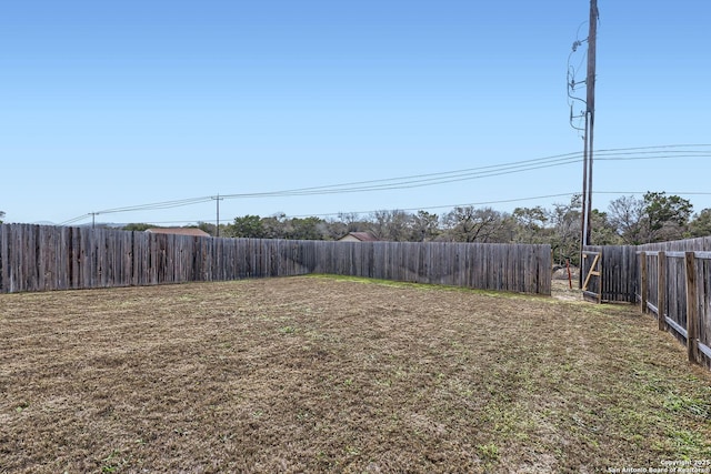 view of yard featuring a fenced backyard