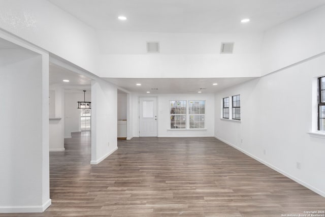 unfurnished living room featuring hardwood / wood-style floors