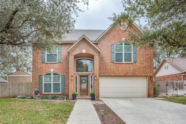 view of property with a garage and a front yard