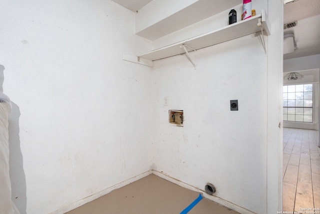 laundry room featuring hardwood / wood-style flooring, hookup for an electric dryer, and hookup for a washing machine