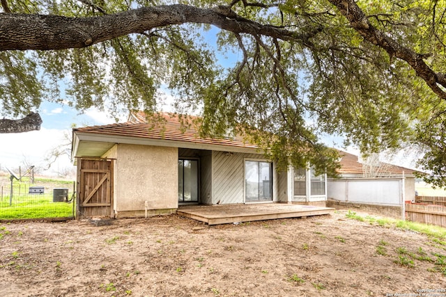 rear view of house with central AC