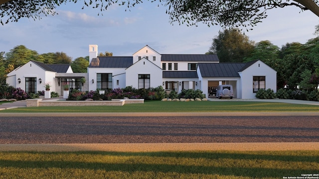 modern farmhouse featuring a front yard