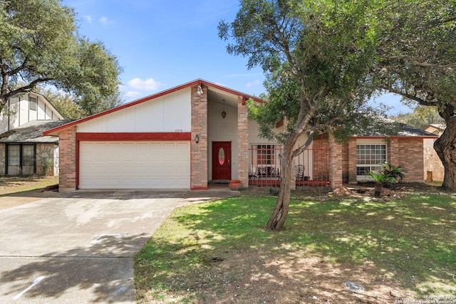 mid-century modern home featuring brick siding, a front lawn, concrete driveway, and a garage