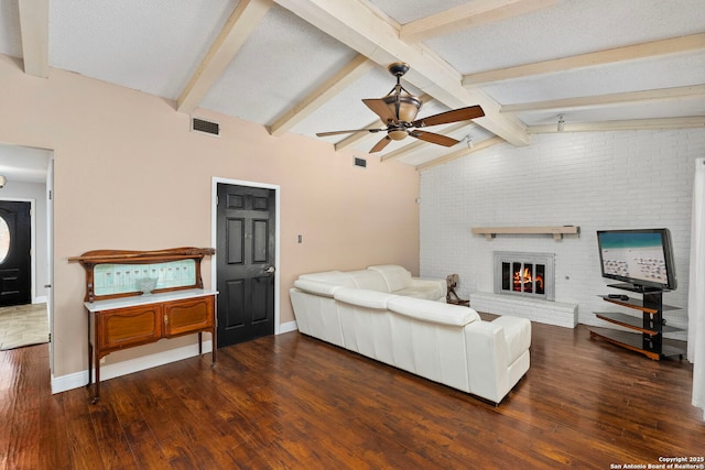 living room featuring dark wood finished floors, vaulted ceiling with beams, visible vents, and ceiling fan