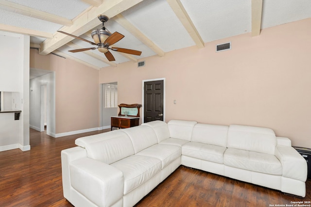 living room with wood finished floors, vaulted ceiling with beams, a ceiling fan, and visible vents