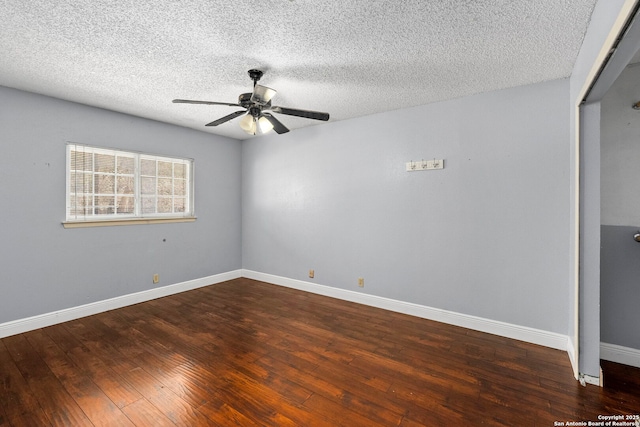 empty room featuring a textured ceiling, baseboards, a ceiling fan, and wood-type flooring