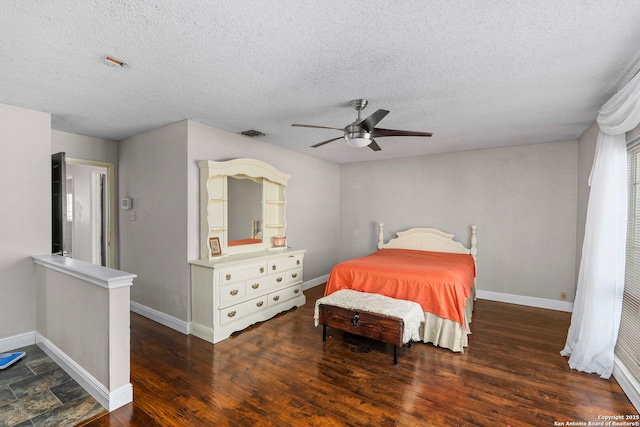 bedroom featuring ceiling fan, baseboards, and wood finished floors