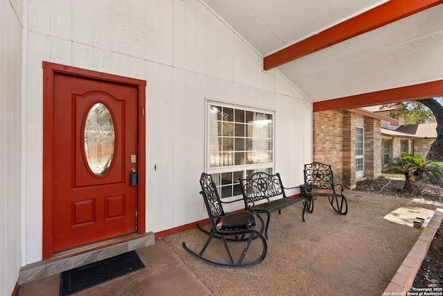 view of exterior entry featuring a porch