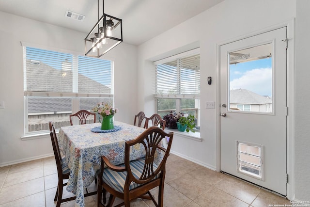 dining area featuring light tile patterned flooring
