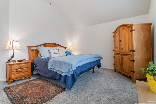 bedroom featuring light carpet and lofted ceiling