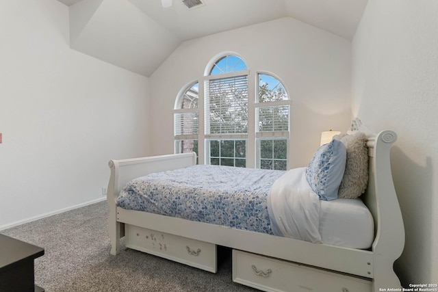 carpeted bedroom with vaulted ceiling