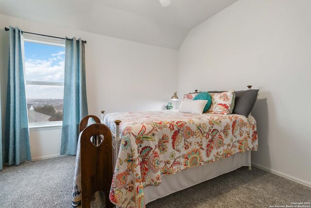 bedroom with lofted ceiling and carpet floors