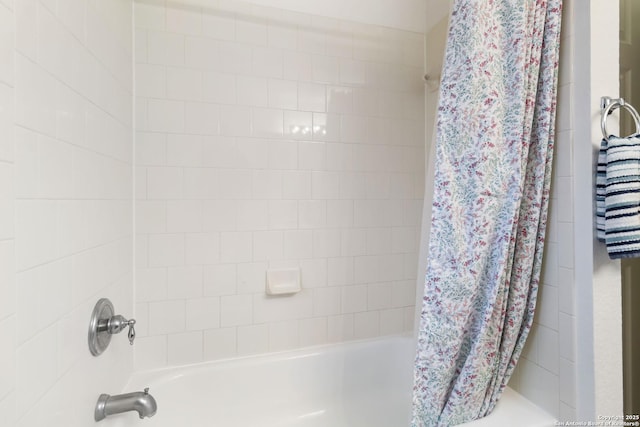 bathroom featuring shower / bathtub combination with curtain