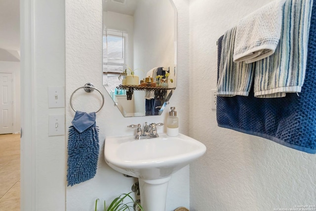 bathroom with tile patterned flooring