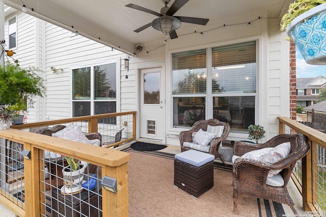 wooden terrace featuring ceiling fan