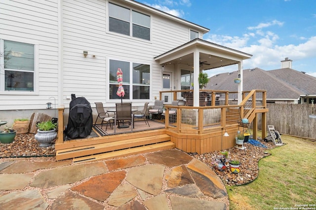 deck featuring ceiling fan and a patio area