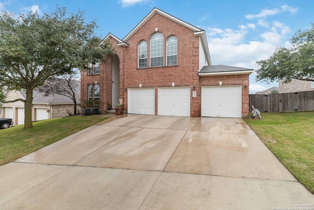 front facade featuring a front lawn and a garage