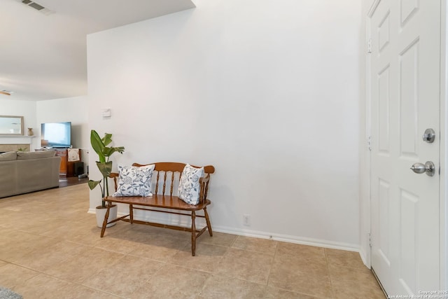 sitting room with light tile patterned floors