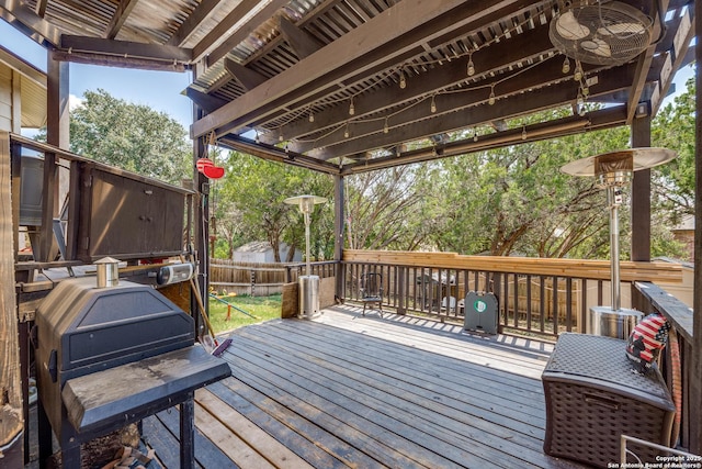 deck with ceiling fan and a pergola