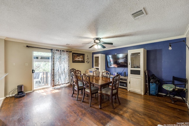 dining space featuring ceiling fan, ornamental molding, dark hardwood / wood-style floors, and a textured ceiling