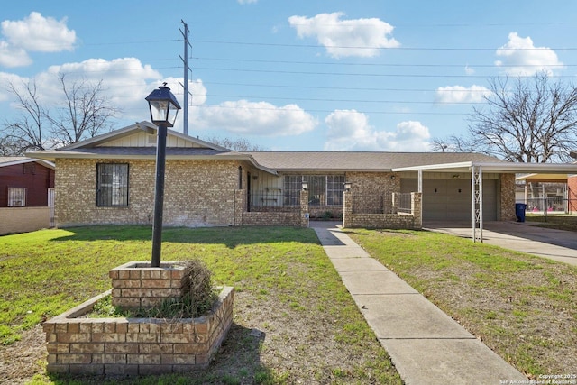 view of front facade with a front yard, a garage, and a carport