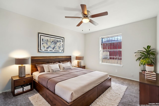 bedroom with dark carpet and ceiling fan