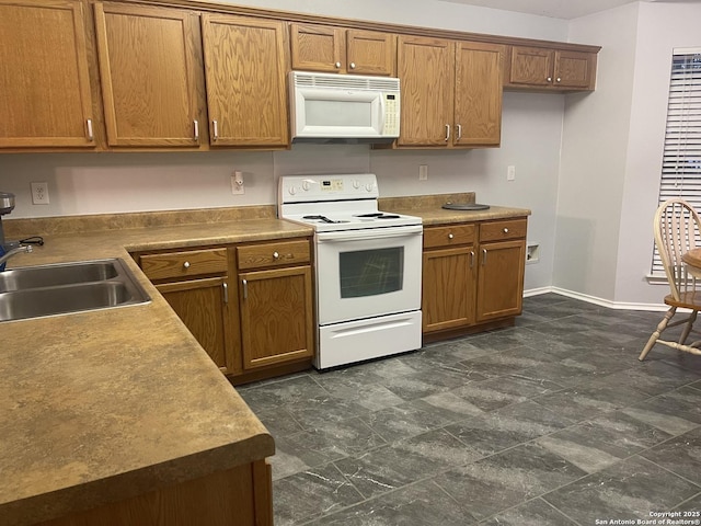 kitchen with sink and white appliances