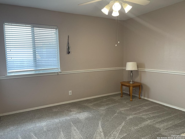 carpeted empty room featuring ceiling fan