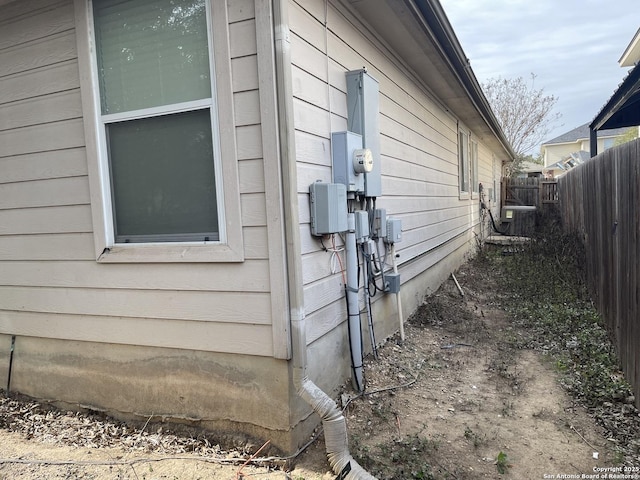 view of side of home featuring central AC unit