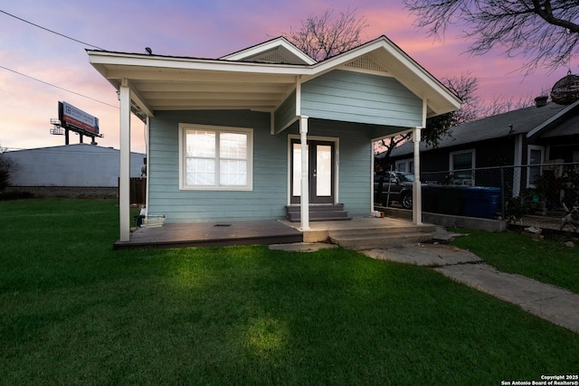 view of front of house featuring a porch and a lawn