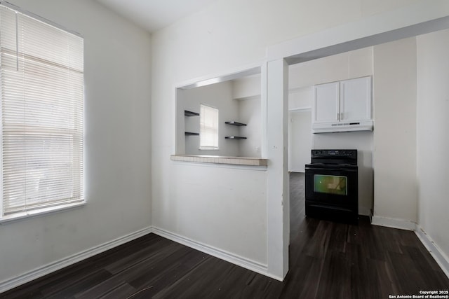 kitchen with white cabinets, a wealth of natural light, dark hardwood / wood-style flooring, and black range with electric stovetop