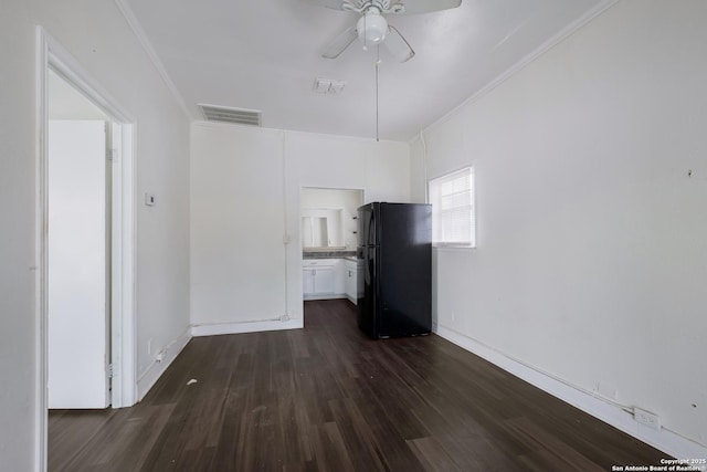 interior space with ornamental molding, dark hardwood / wood-style floors, and ceiling fan