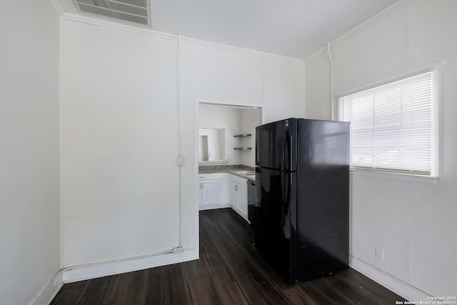 kitchen featuring white cabinetry, ornamental molding, black appliances, and dark hardwood / wood-style flooring