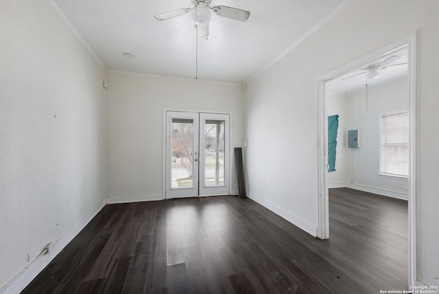 empty room with ornamental molding, french doors, dark hardwood / wood-style floors, and ceiling fan