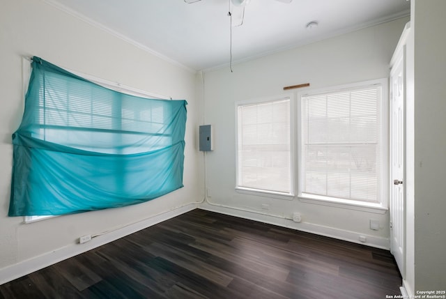 unfurnished room featuring dark hardwood / wood-style flooring and ornamental molding