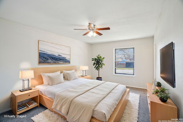 bedroom with dark colored carpet and ceiling fan