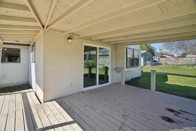 wooden deck with a lawn