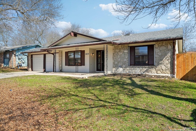 ranch-style home with covered porch, a front lawn, and a garage