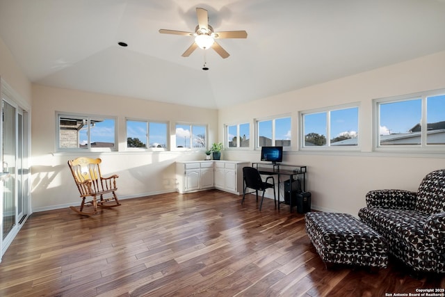 sitting room featuring ceiling fan, plenty of natural light, vaulted ceiling, and hardwood / wood-style floors