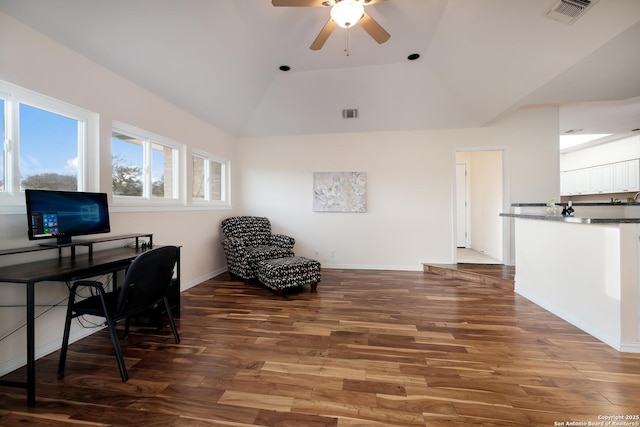 home office featuring ceiling fan, vaulted ceiling, and dark hardwood / wood-style flooring