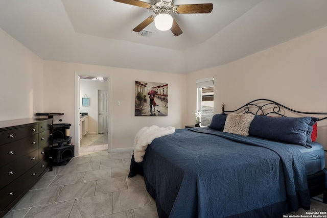 bedroom featuring a tray ceiling and ceiling fan